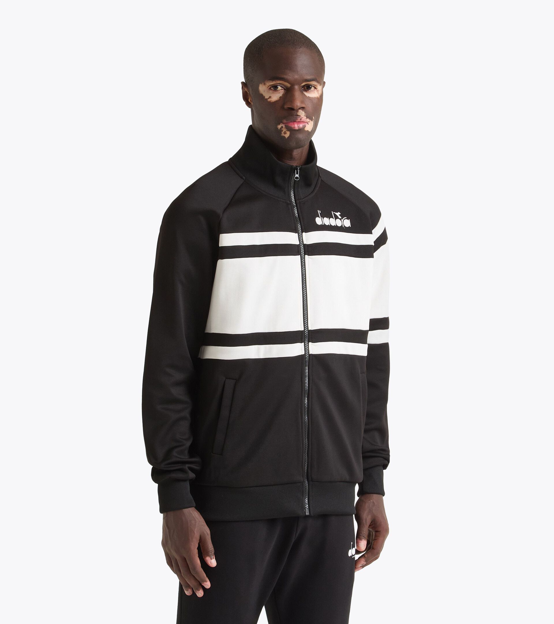Chaqueta deportiva inspirada en los 80 - Para todos los géneros JACKET 80S BLANCO VIVO/NEGRO - Diadora
