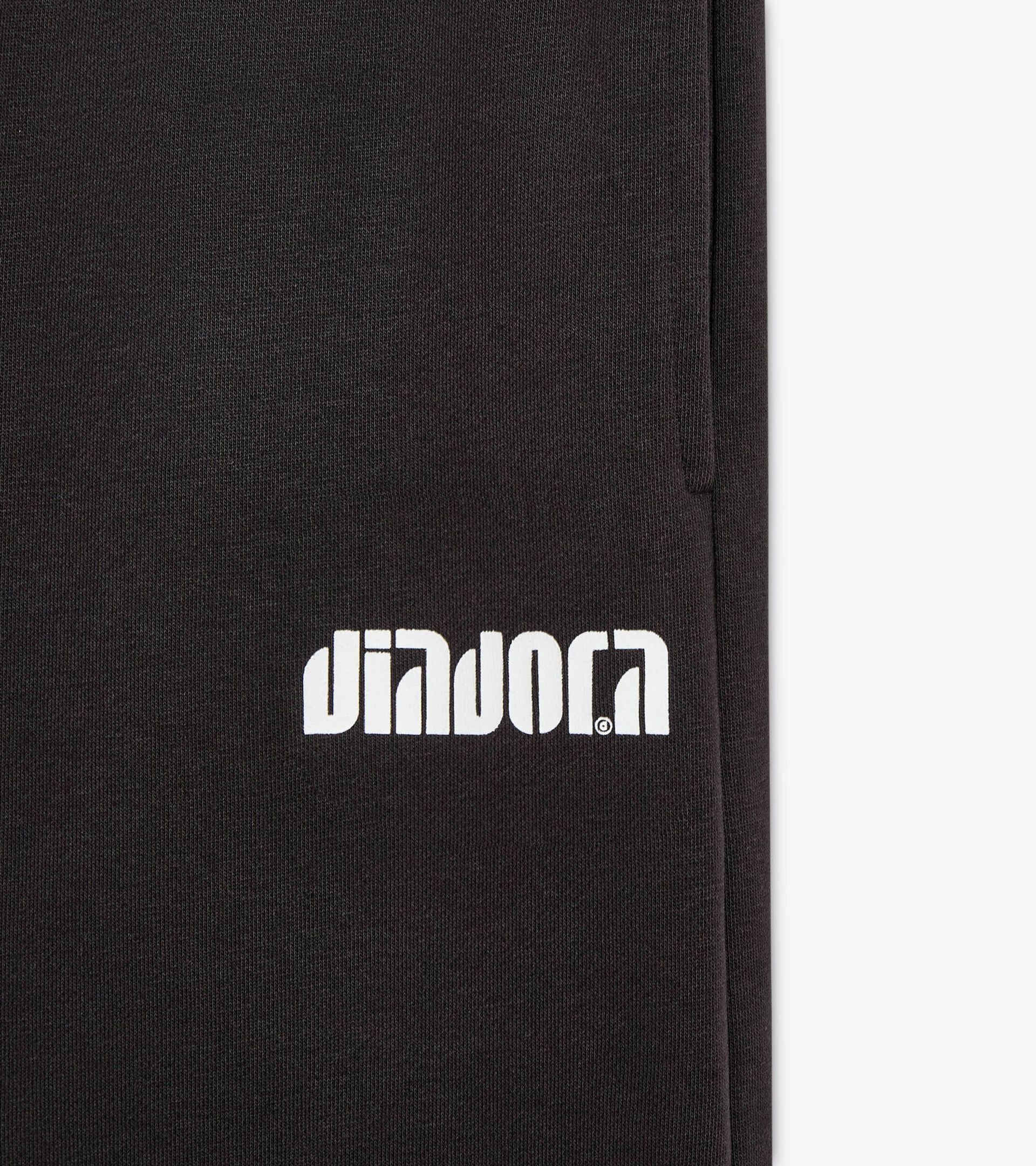 Trackpants with a relaxed fit - Women’s
 L. PANTS FLARE ATHL. LOGO BLACK - Diadora