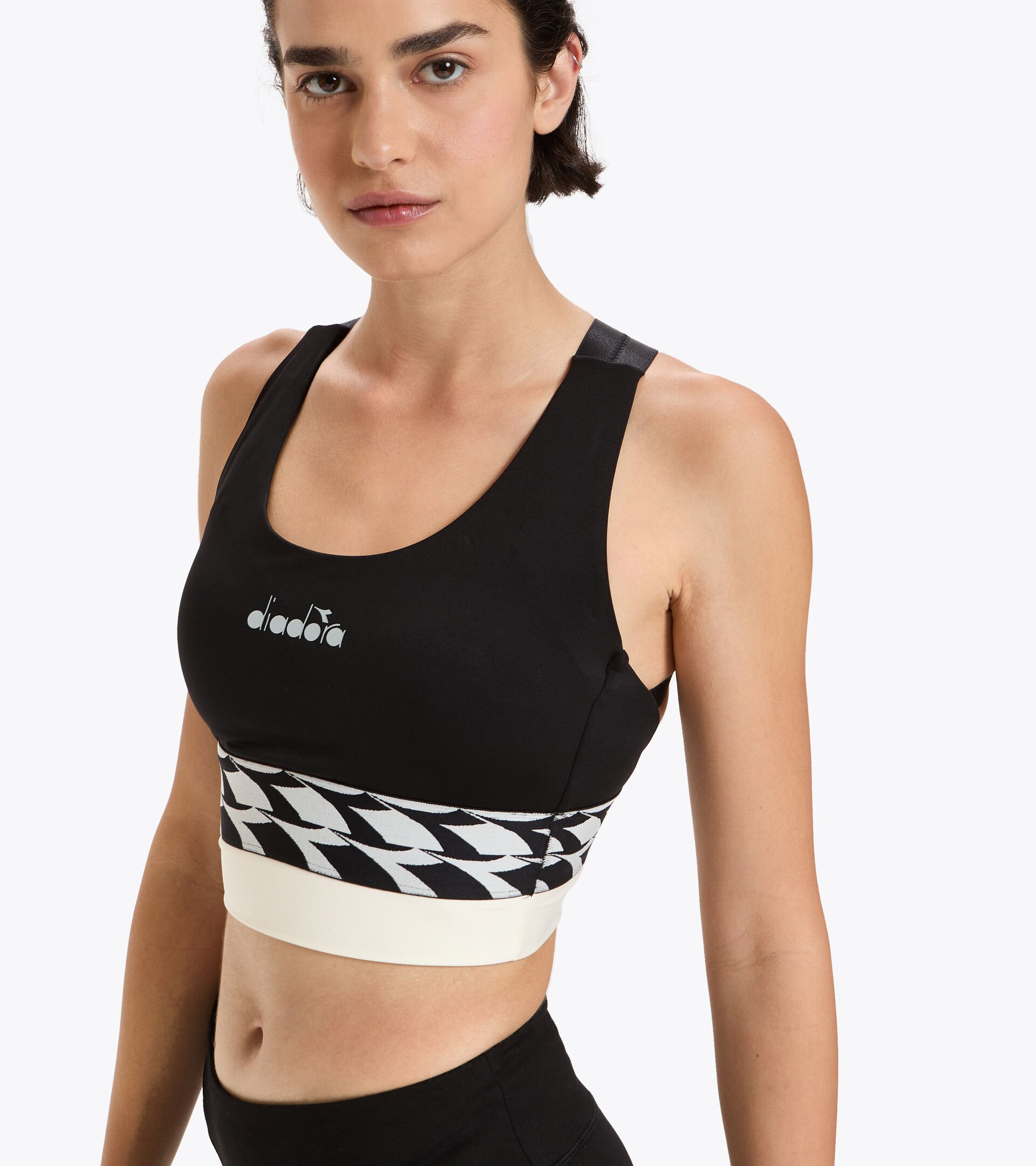 Sports bra for running - Women L. MEDIUM SUPPORT BRA WHISPER WHITE/BLACK - Diadora