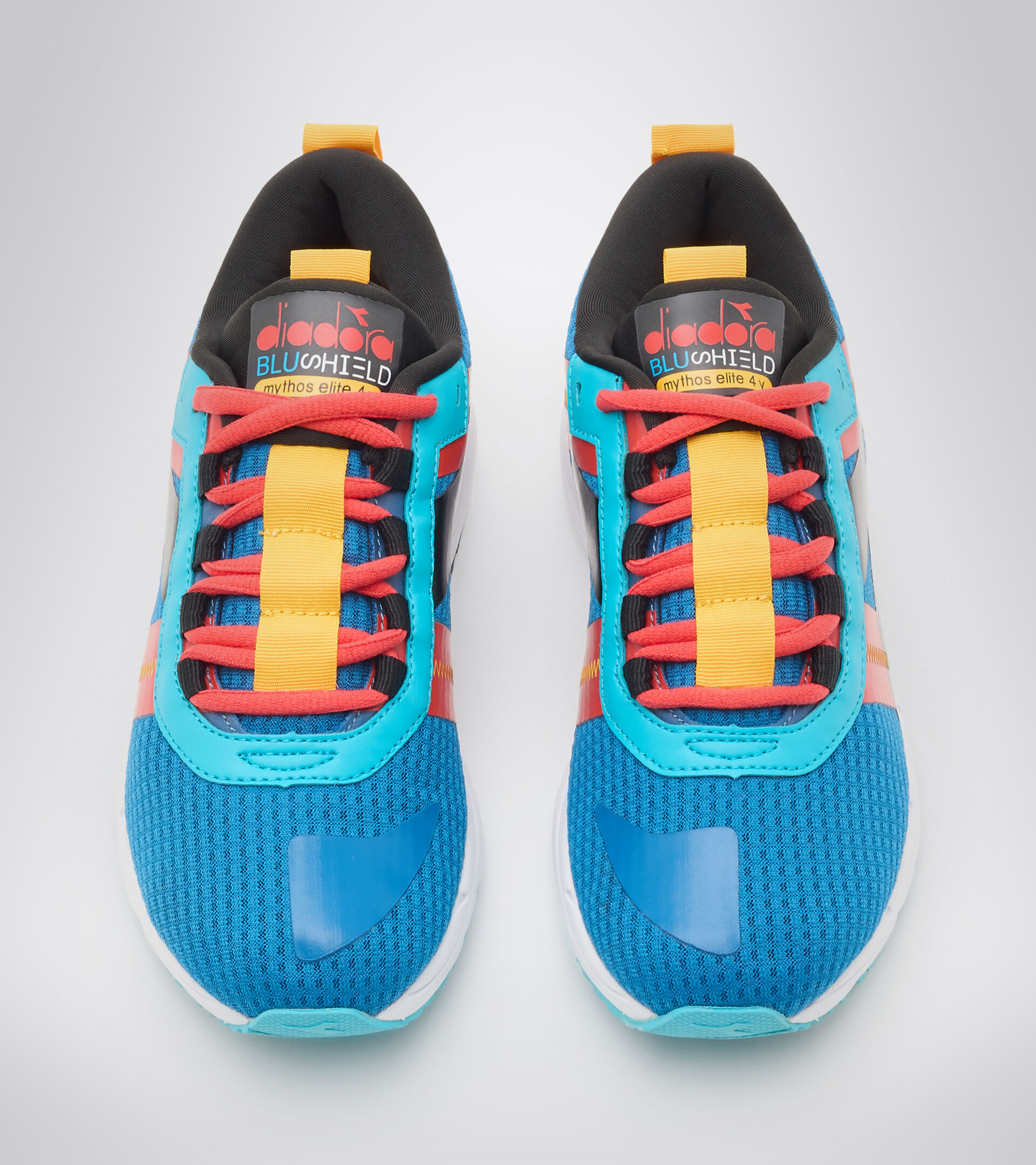 Footwear Sport BAMBINO MYTHOS BLUSHIELD ELITE 4 Y AZUL MIKONOS/NEGRO/ROJO FIESTA Diadora