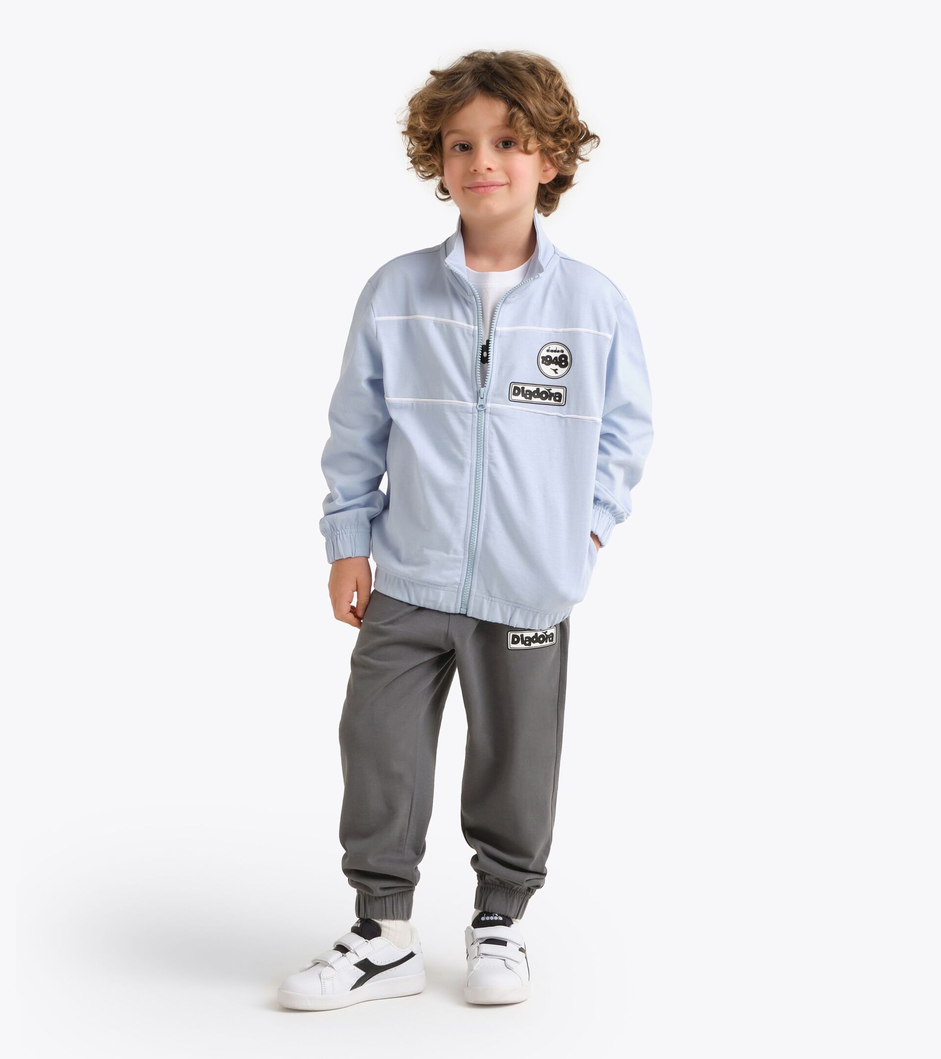 Surv&ecirc;tement de sport - Ado gar&ccedil;on et fille
 JU. TRACKSUIT FZ ESS. SPORTS  (HJ) TURBULENCE - Diadora