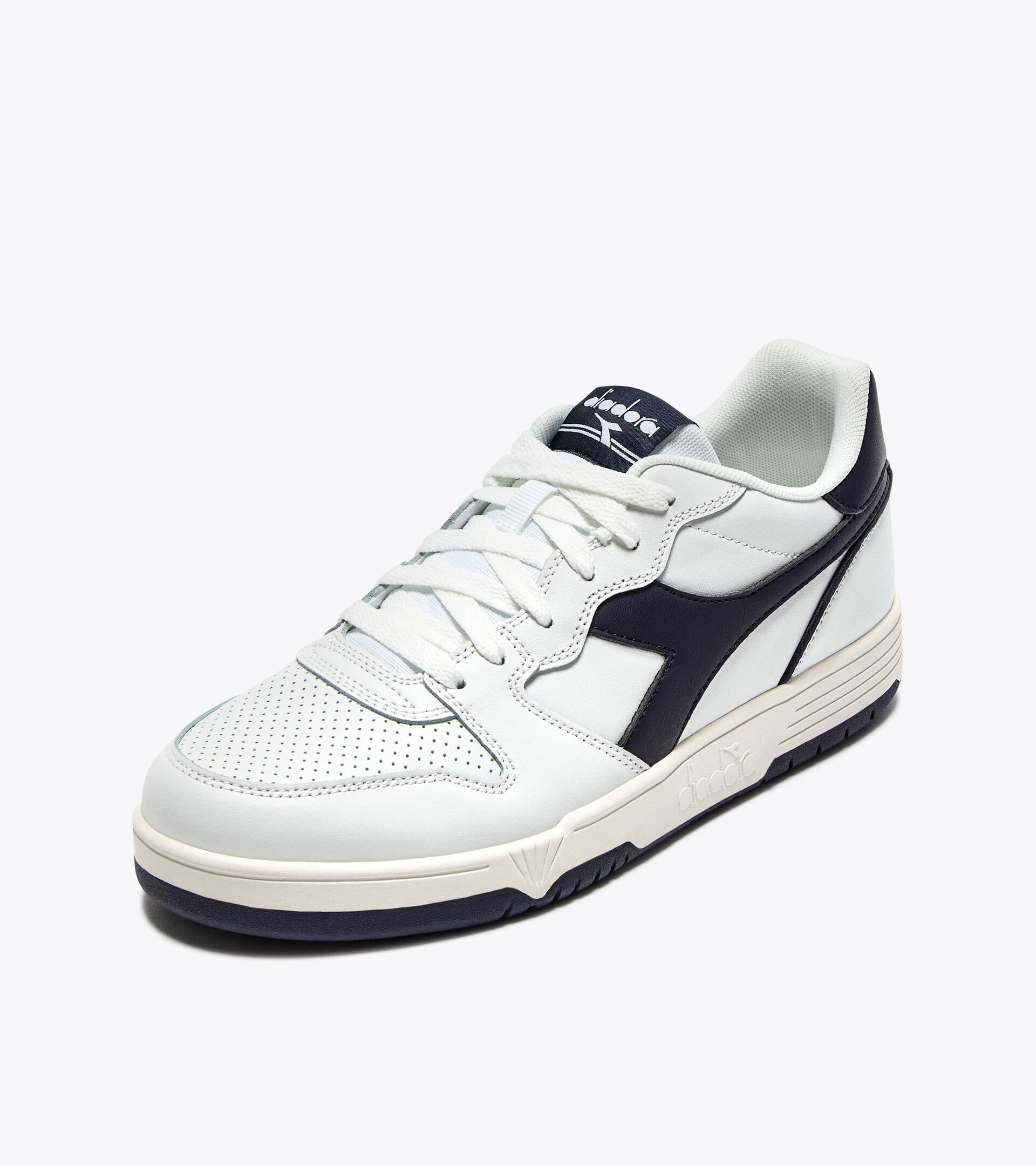 Zapatilla de piel - Para todos los géneros
 DEUCE BLANCO/AZUL CHAQUETON - Diadora
