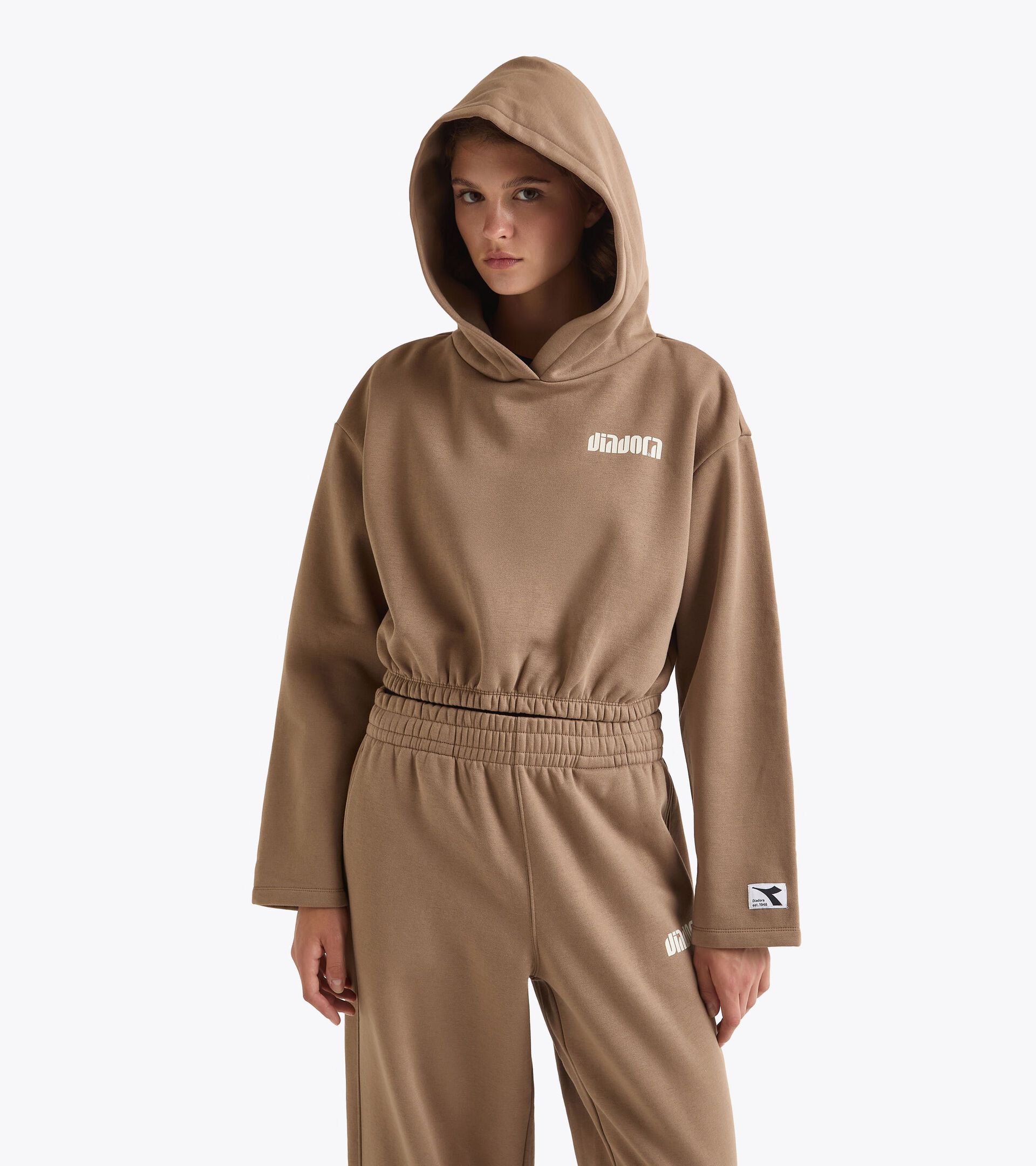 Hoodie cropped - Femme
L. HOODIE ATHL. LOGO TEINTE SEPIA - Diadora