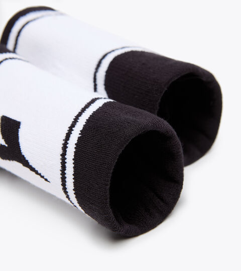 WRISTBANDS WIDE LOGO, BLACK/OPTICAL WHITE Serre-poignets contre la transpiration - Unisexe WRISTBANDS WIDE LOGO BLACK/OPTICAL WHITE - Diadora