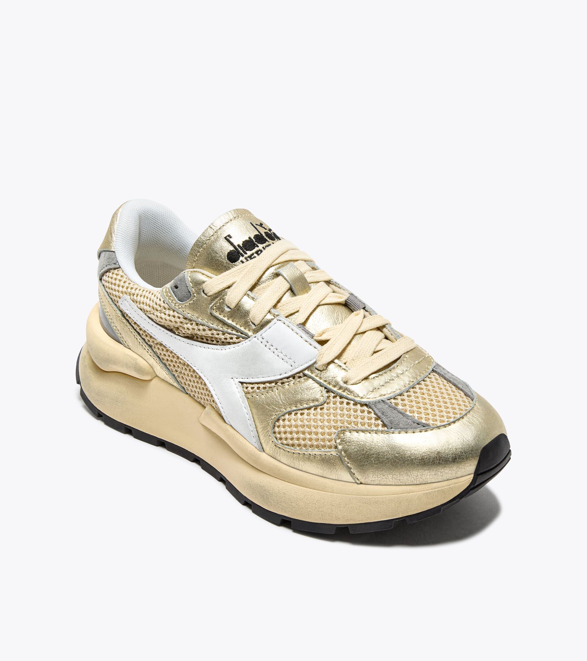 Zapatilla Heritage de piel laminada - Mujer
 MERCURY ELITE LAM USED  WN MANZANILLA - Diadora