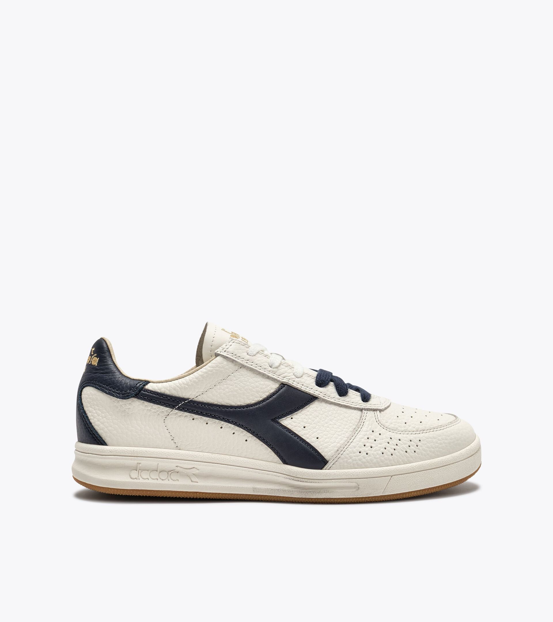 Zapatilla Heritage de piel - Para todos los g&eacute;neros
 B.ELITE DOMINIO BLANCO/AZUL CHAQUETON - Diadora