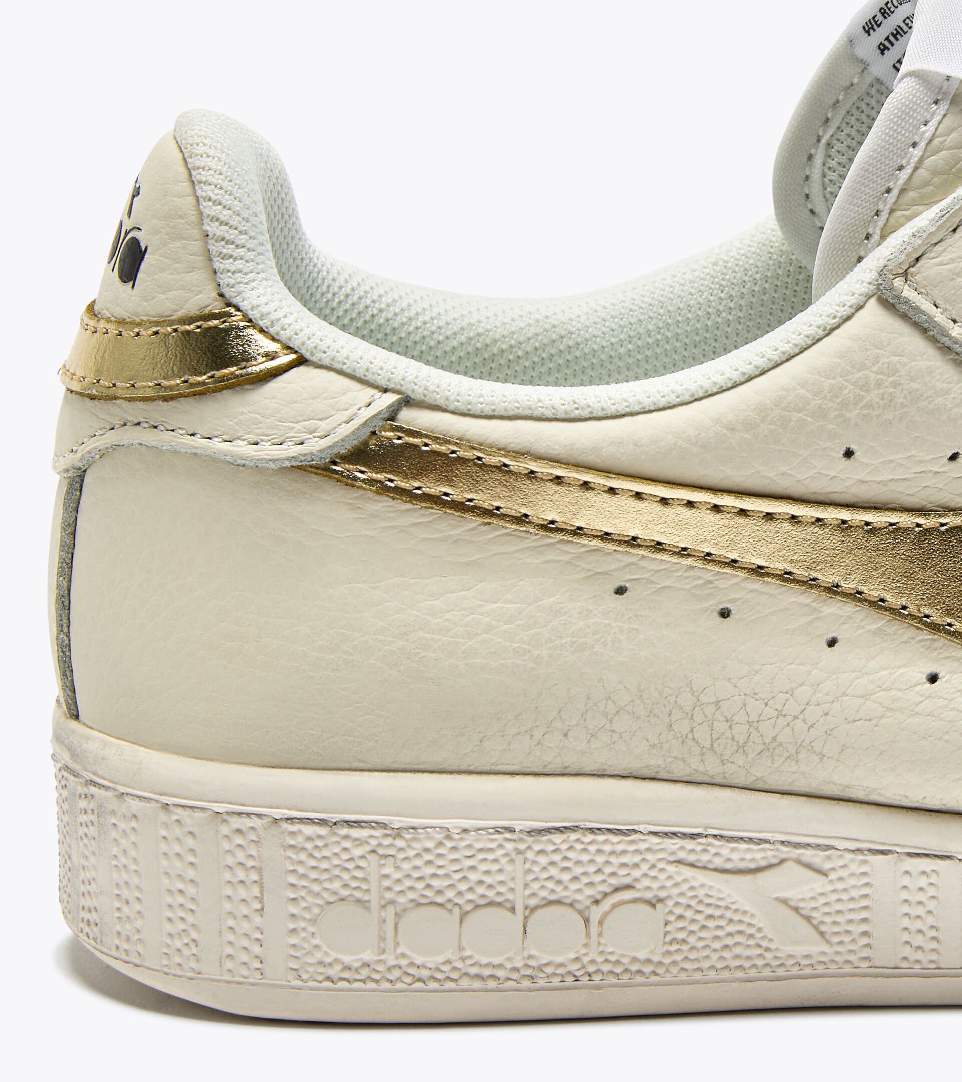 Leather sports sneakers - Women&rsquo;s GAME L LOW WAXED METAL WN WHITE/GOLD - Diadora