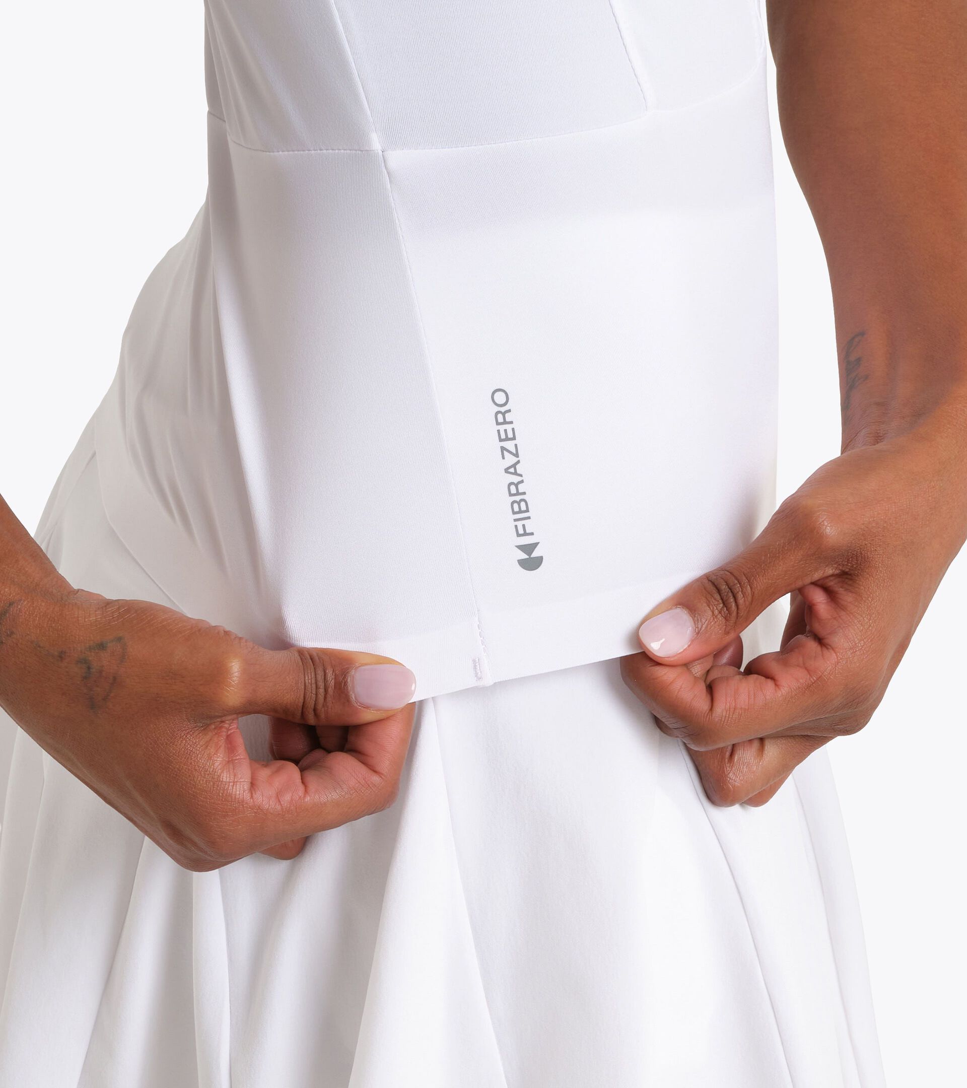 Top t&eacute;cnico con tecnolog&iacute;a FIBRAZERO - Competici&oacute;n - Mujer L. TANK MATCH FIBRAZERO BLANCO VIVO - Diadora