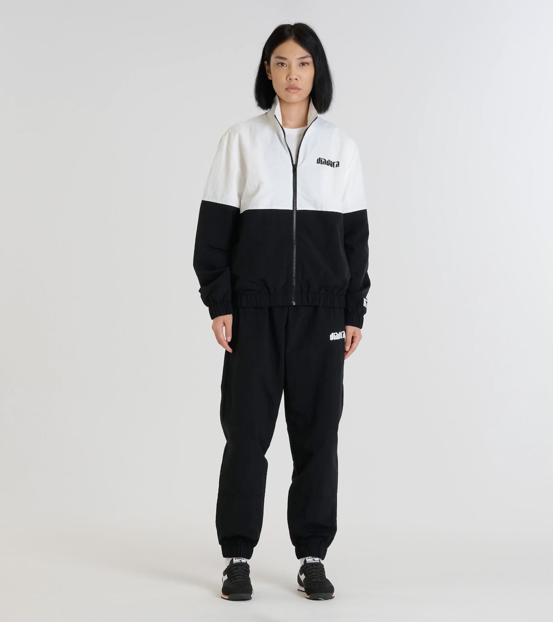 Chándal de poliamida - Para todos los géneros TRACKSUIT ATHL. LOGO II NEGRO - Diadora