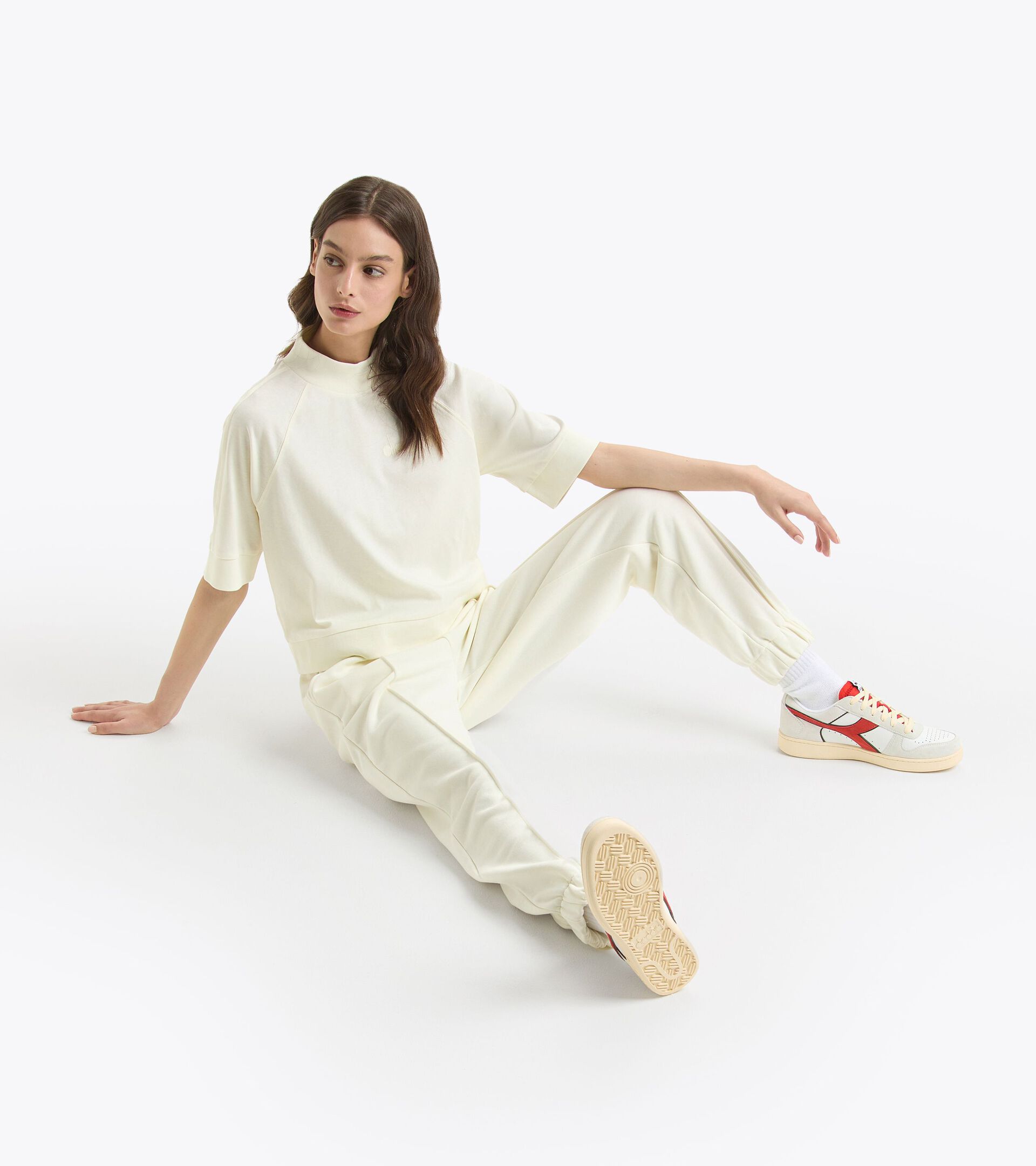 Casual sweatpants - Women L. PANT ATHL. LOGO BUTTER WHITE - Diadora