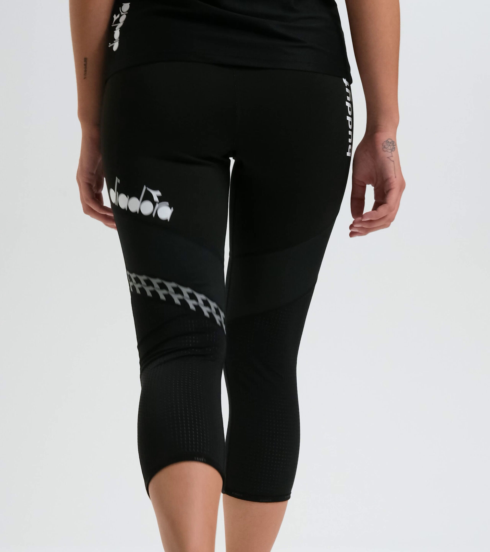 Running leggings - Women L. 6/8 REVERSIBLE TIGHTS BUDDYFIT BLACK - Diadora