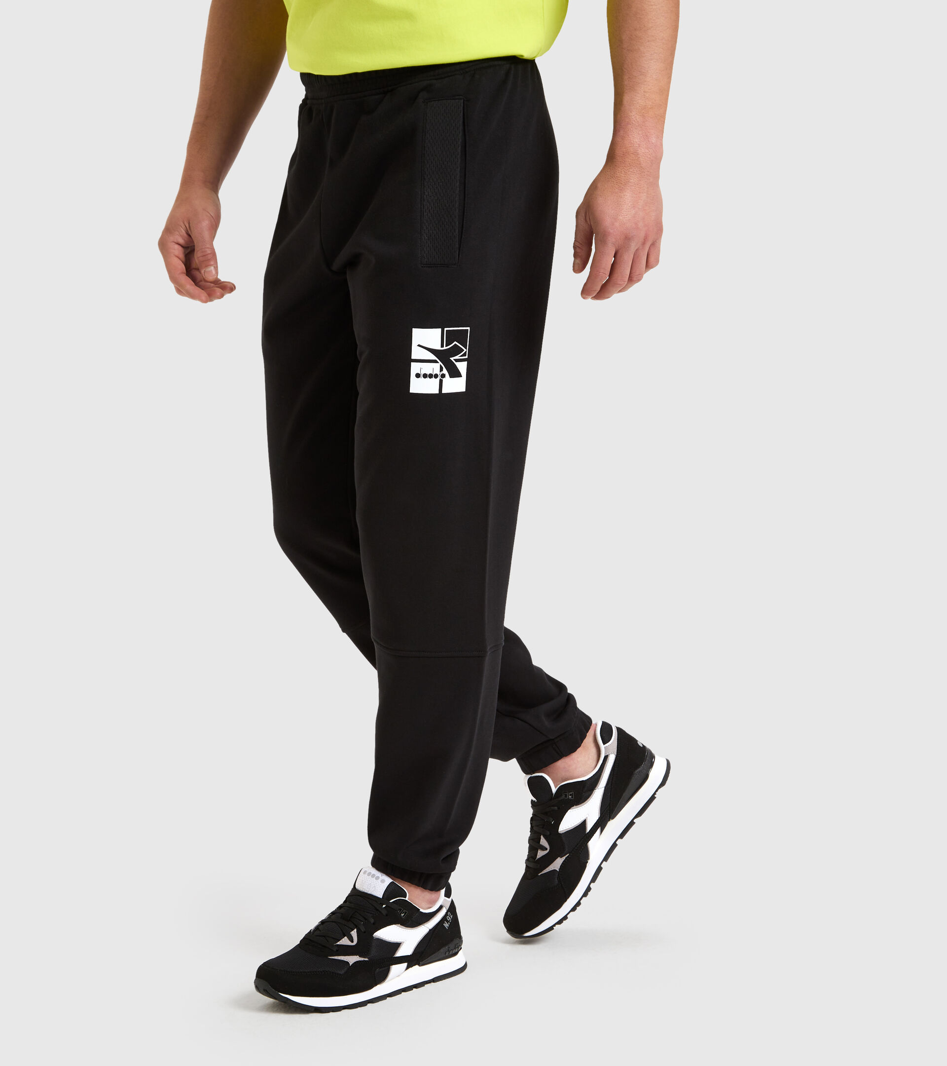 Sports trousers - Men CUFF PANT WEAVE BLACK - Diadora