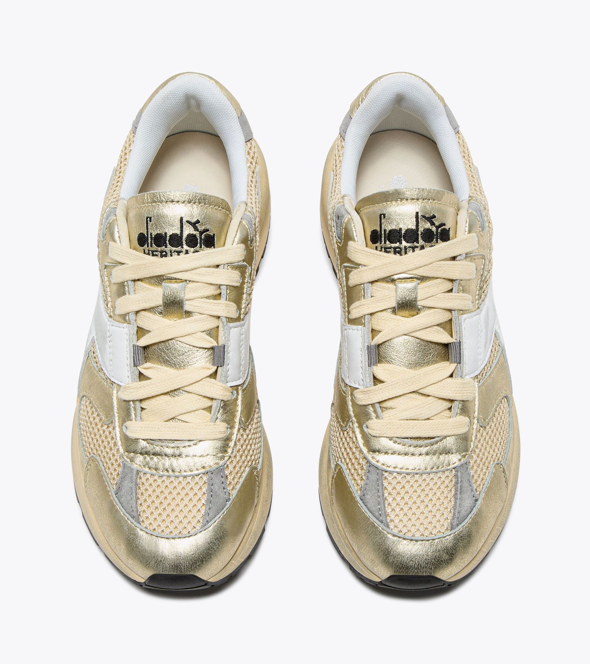 Zapatilla Heritage de piel laminada - Mujer
 MERCURY ELITE LAM USED  WN MANZANILLA - Diadora