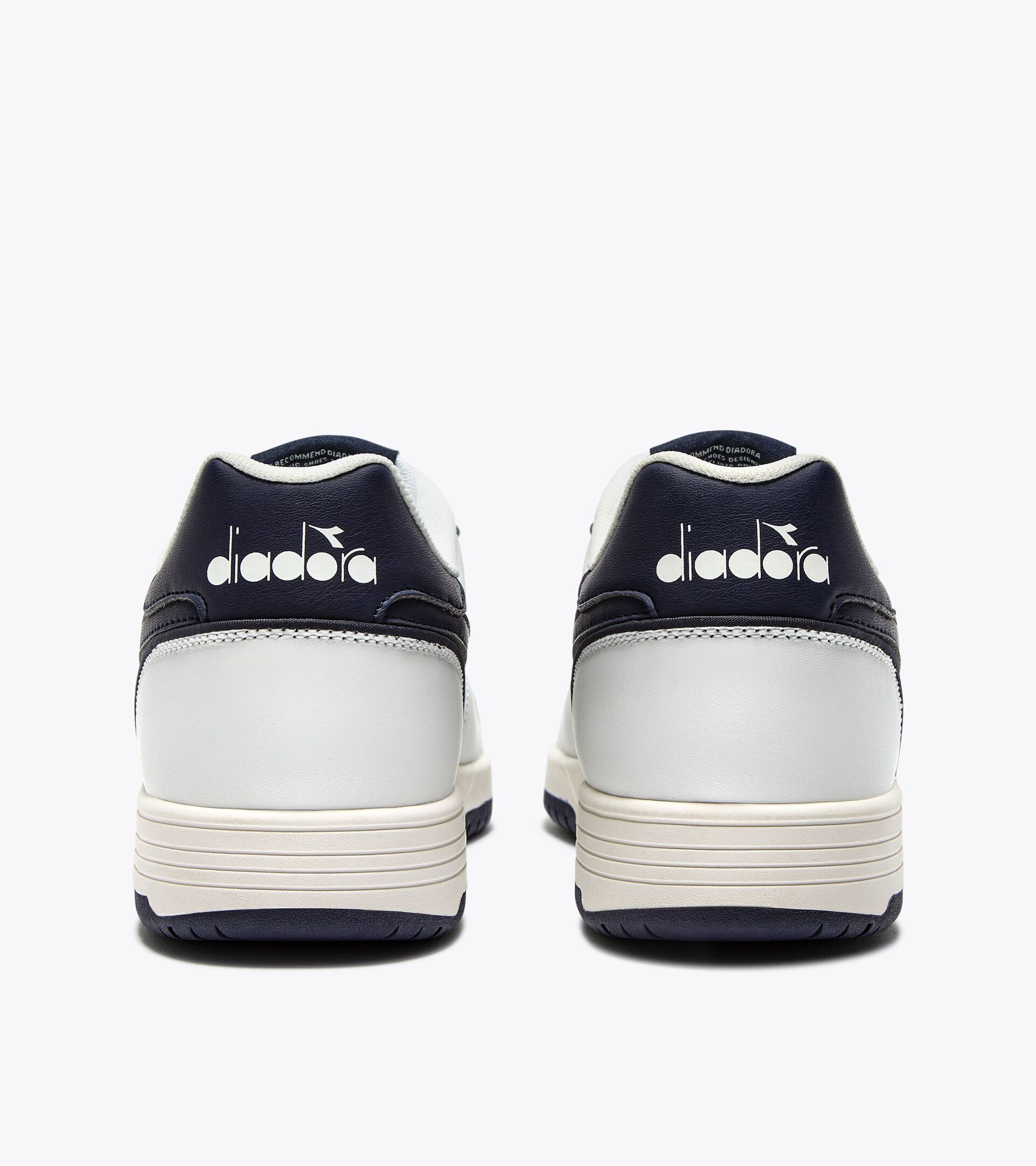Zapatilla de piel - Para todos los géneros
 DEUCE BLANCO/AZUL CHAQUETON - Diadora